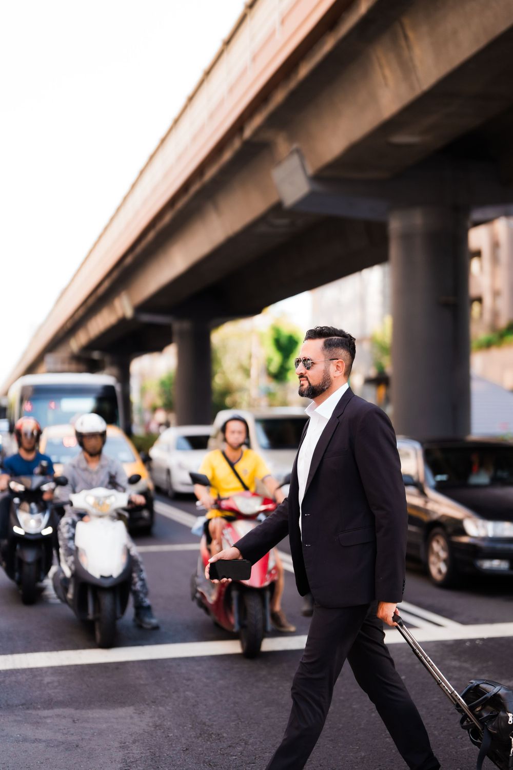 a businessman crossing the street in Taipei city