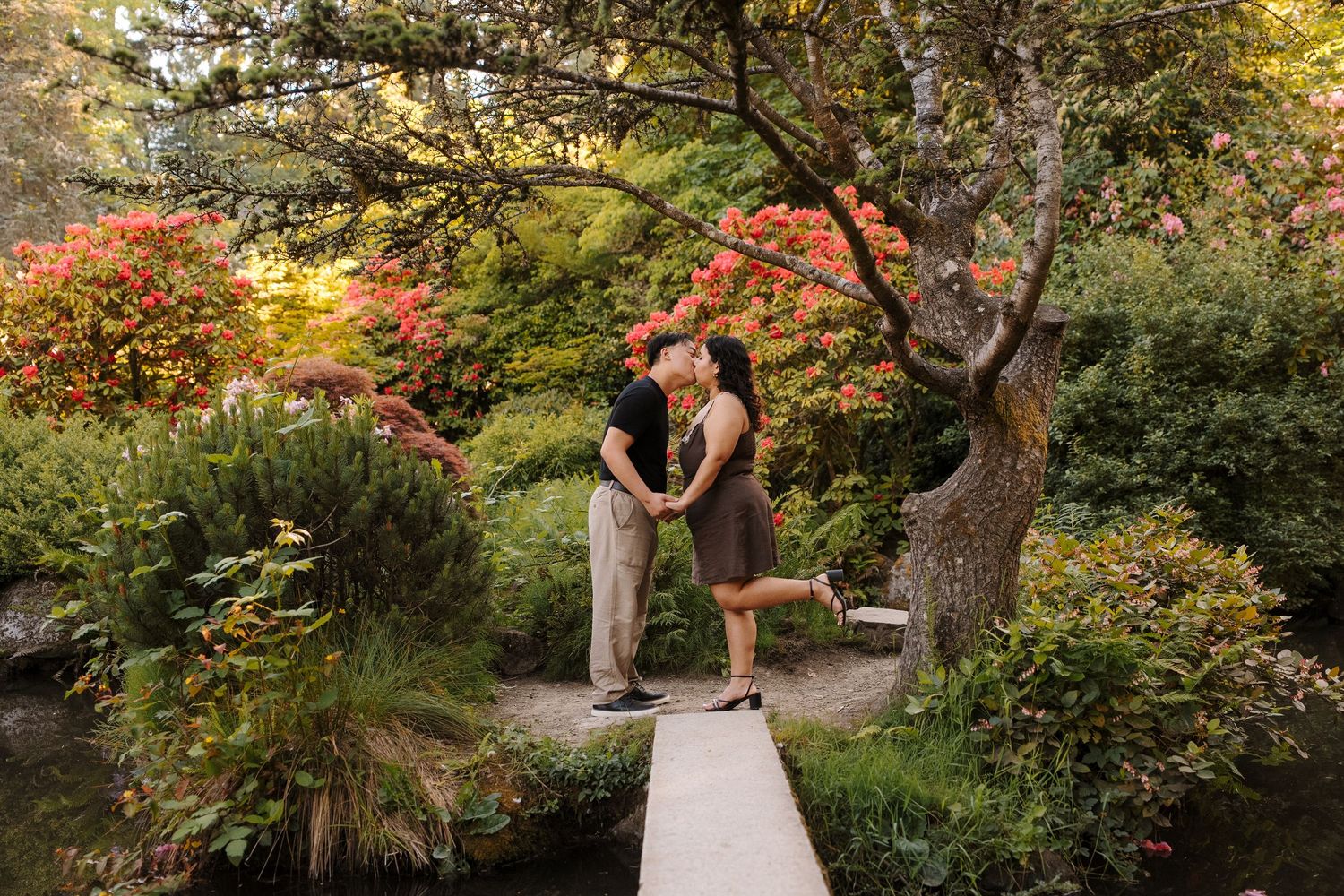 Andrew and Ashley kiss in Kubota Gardens Seattle after their proposal