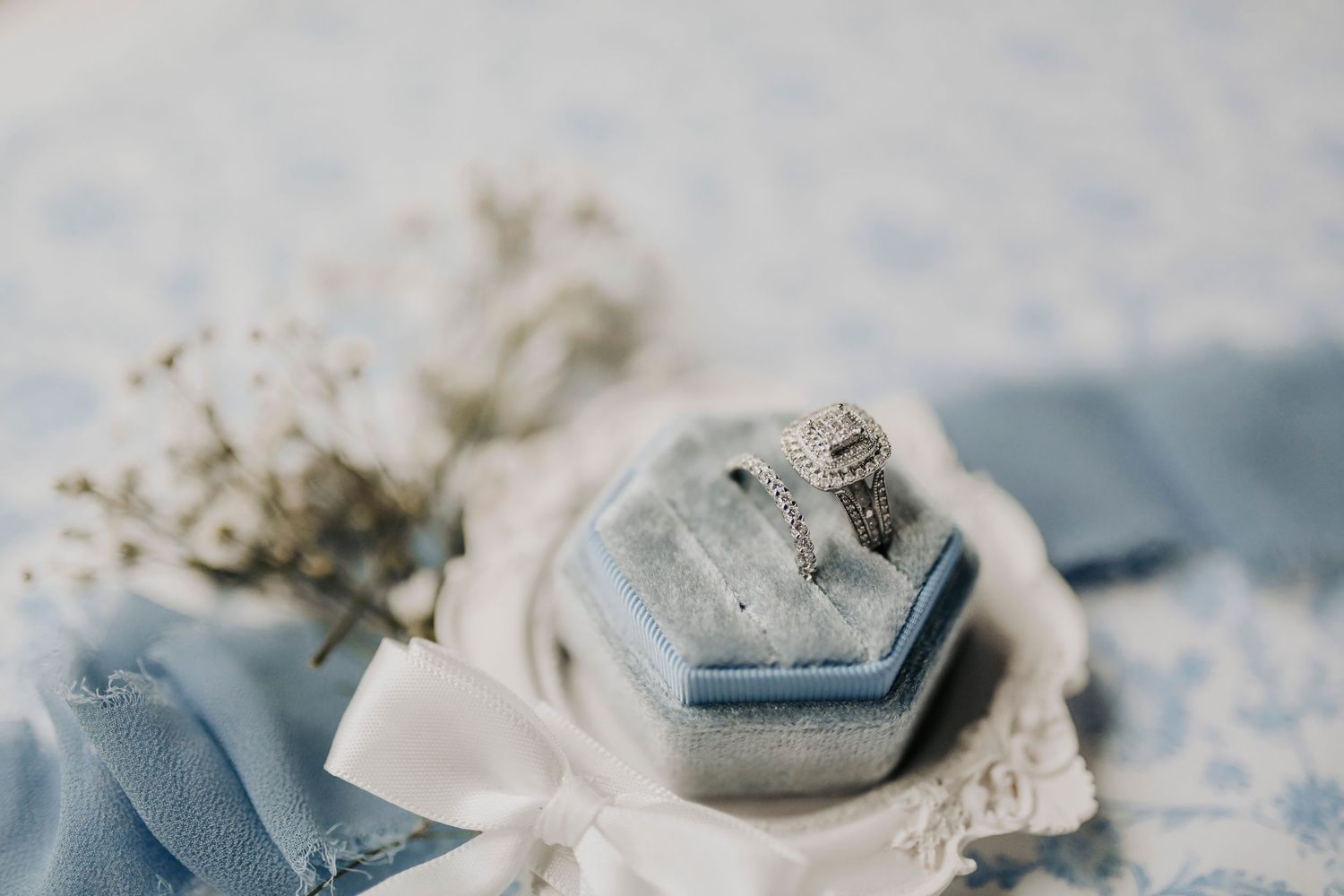 timeless bridal accessories flat lay with pearls and gold accents