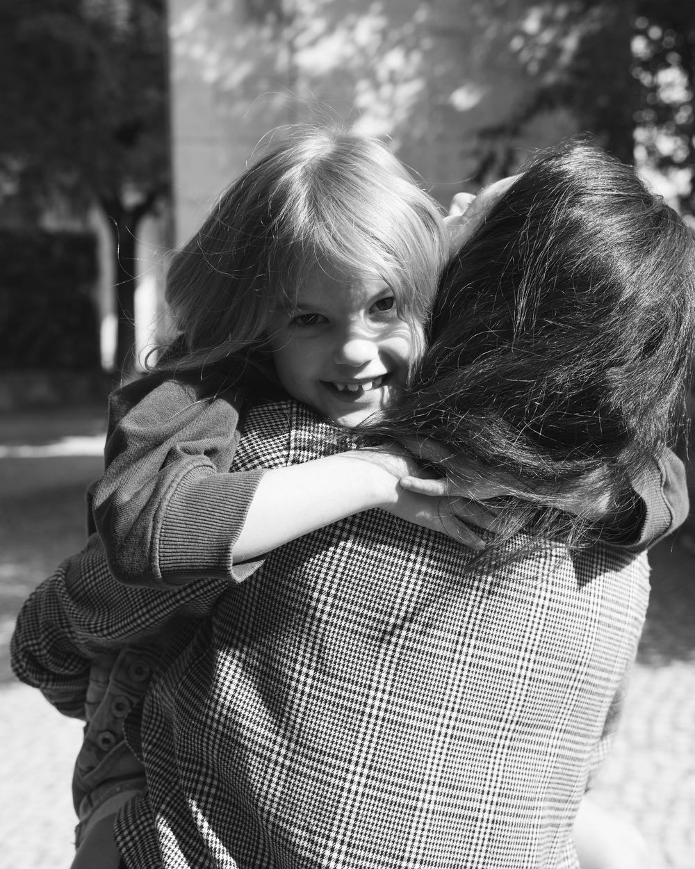 Daughter hugging mother