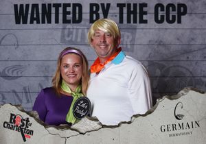 Couple dressed in Scooby-Doo costumes posing at the Wanted by the CCP Charleston party event.