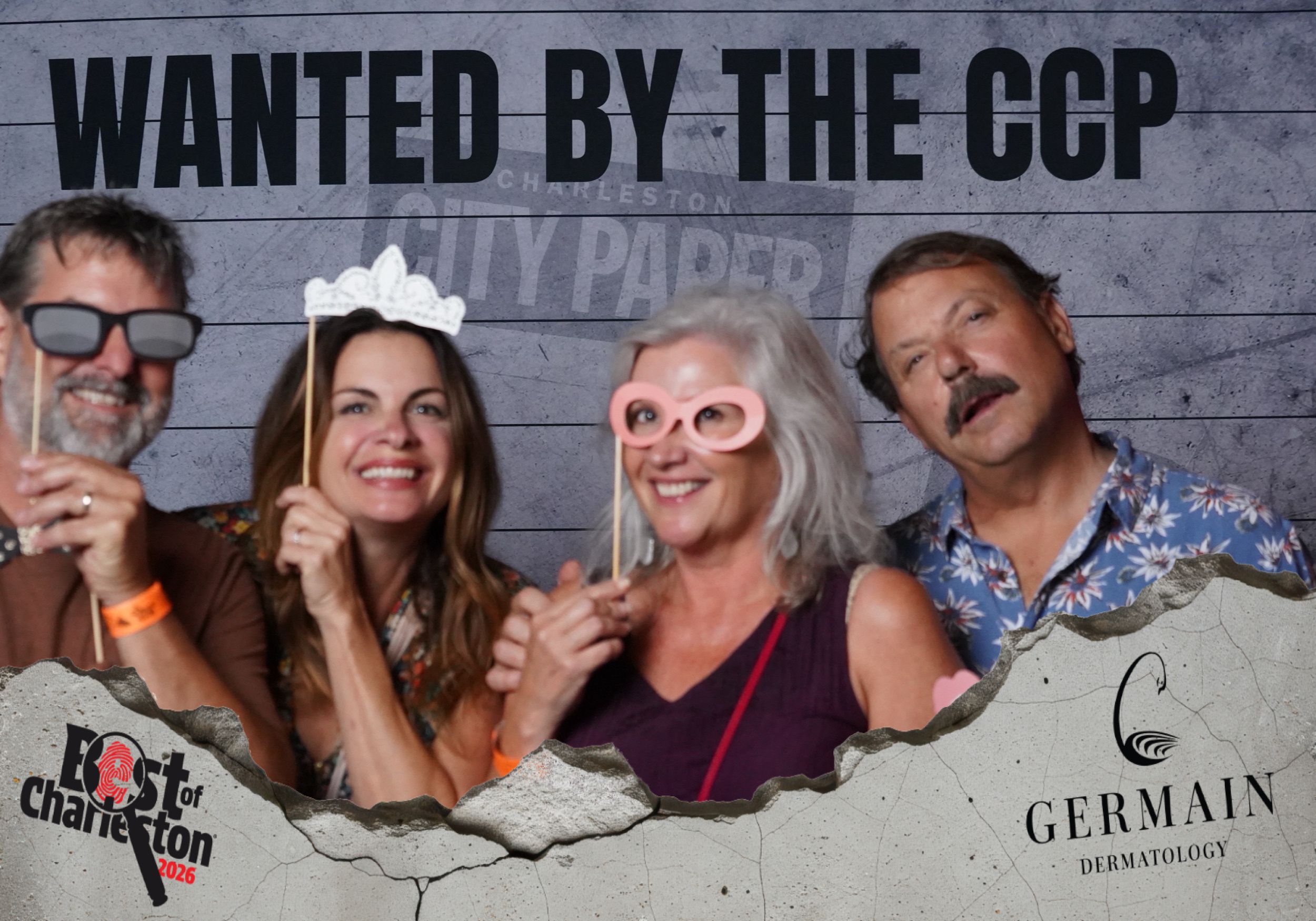 Four people pose with fun props at Best of Charleston City Paper event with Germain Dermatology sponsorship.