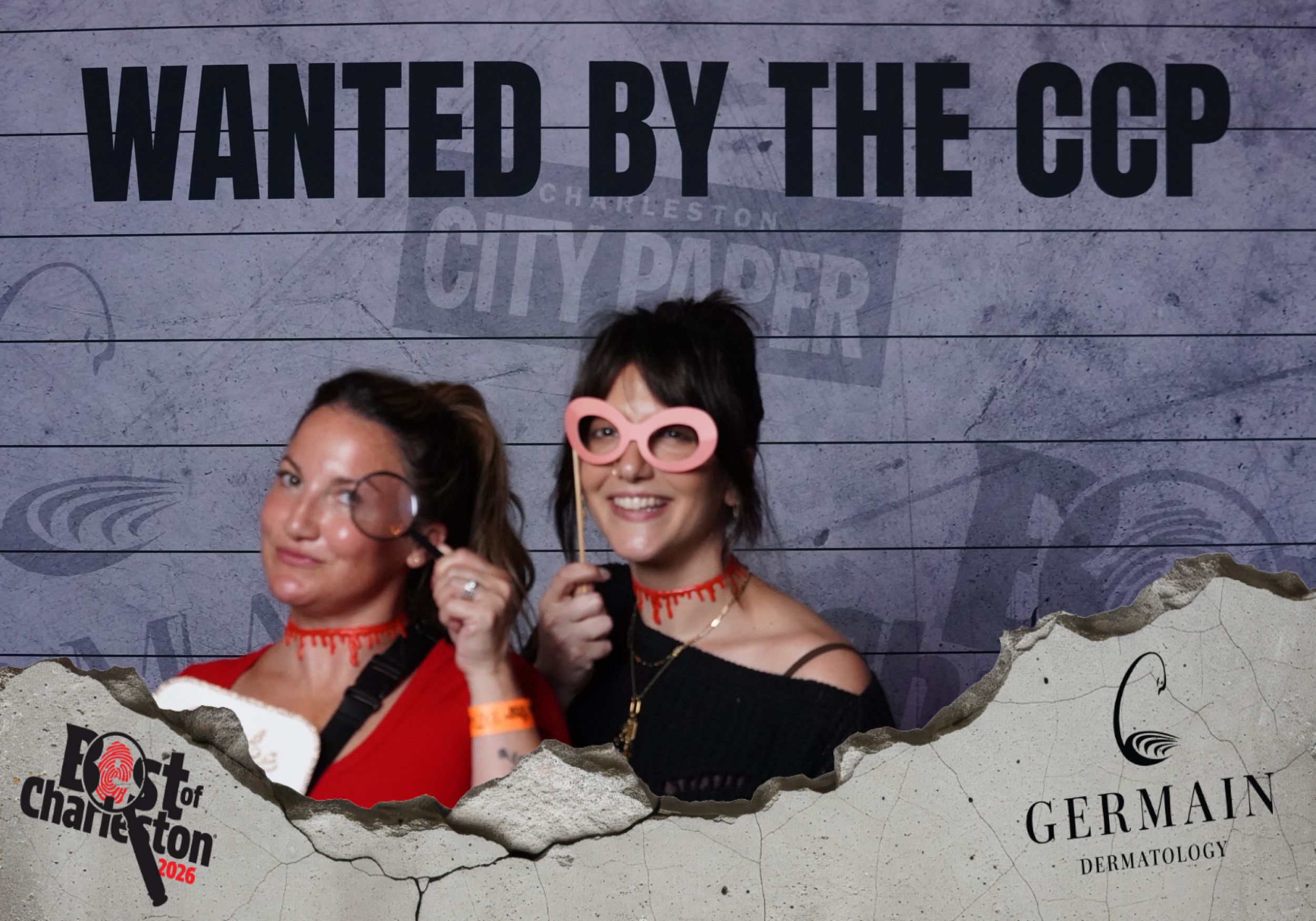 Two women pose with novelty glasses at Best of Charleston City Paper Wanted by the CCP photo booth.