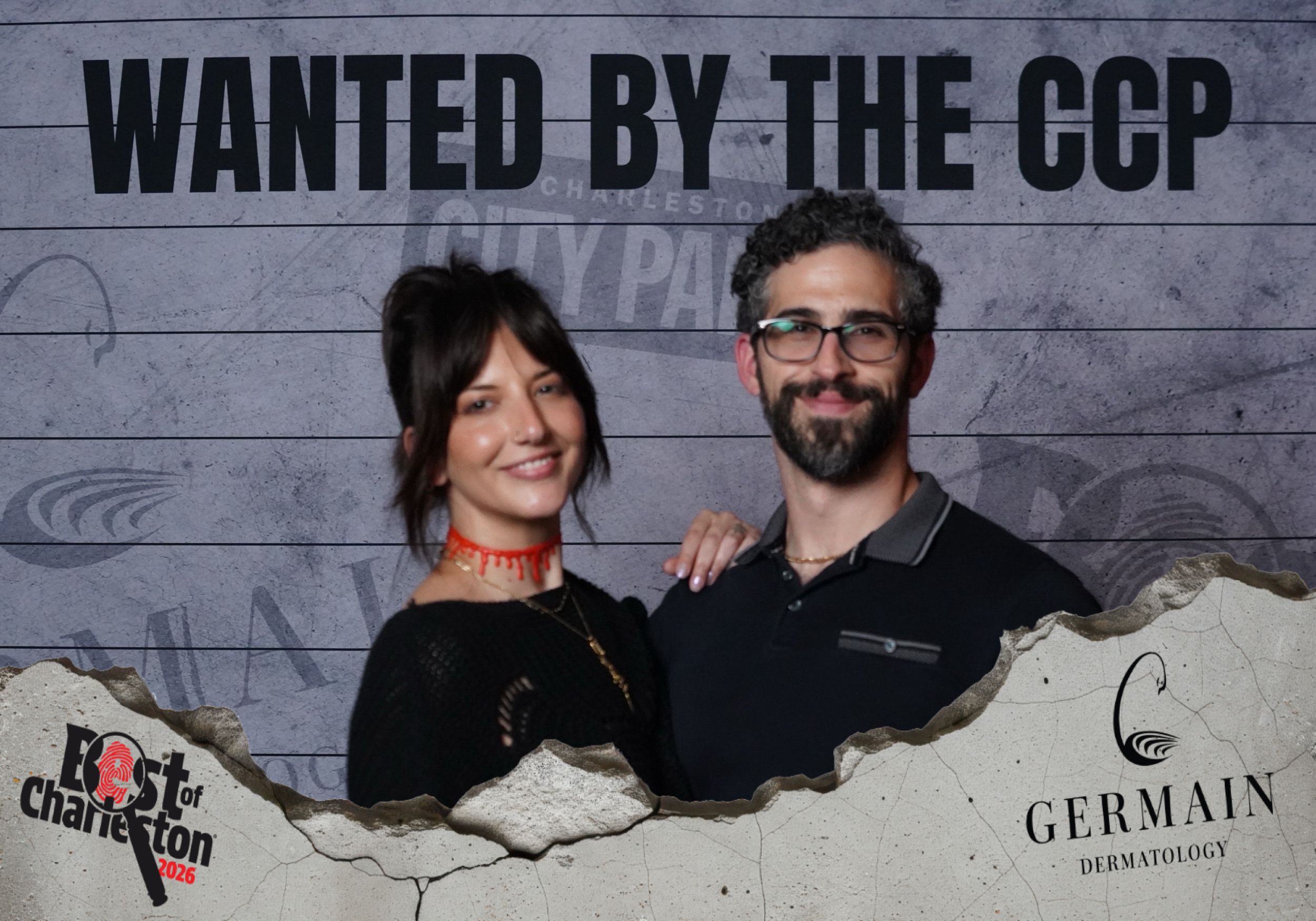 Couple smiling at Best of Charleston Wanted by the CCP photo booth event sponsored by Germain Dermatology.