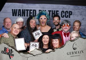 Large fun group posing at Wanted by the CCP Best of Charleston party with costumes and awards.