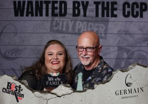 A smiling man and woman pose together at a Best of Charleston City Paper awards event.