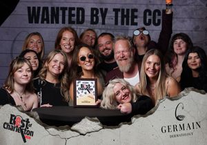 Large group celebrates winning Best of Charleston award at CCP City Paper photo booth.