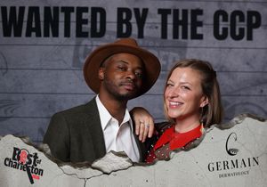 Stylish couple smiling at the Wanted by the CCP Best of Charleston Germain Dermatology event.