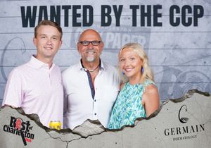 Three people smiling together at the Wanted by the CCP Best of Charleston photo booth.