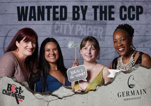Four women smile at Wanted by the CCP City Paper Best of Charleston event with Germain Dermatology signage.