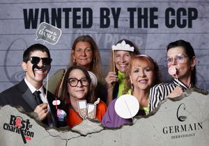 Group of six people posing with fun props at Best of Charleston CCP wanted photo booth event.