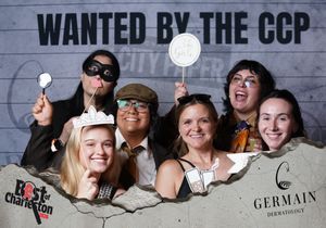 Group of six friends pose with fun props at Wanted by the CCP Best of Charleston photo booth event.
