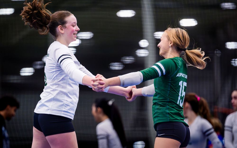 Asphalt Green VB Club players meet at the net during May Madness at Spooky Nook by Deanna Fox, SportsFox Photography based in Hershey PA