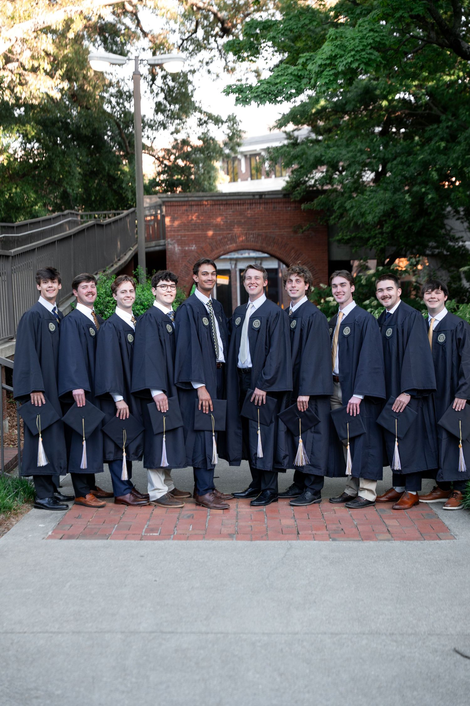Smiling graduate poses for the best Atlanta grad photos at Georgia Tech with portraits by Pierre The Pear Photography