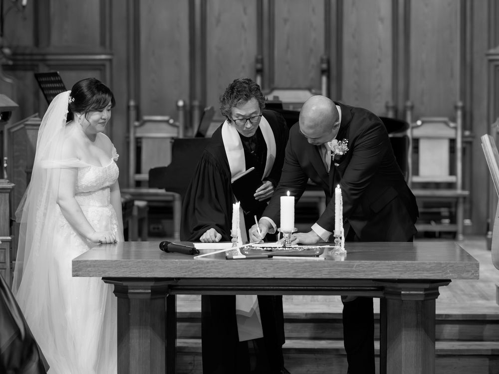 Signing a marriage license during a Toronto wedding session