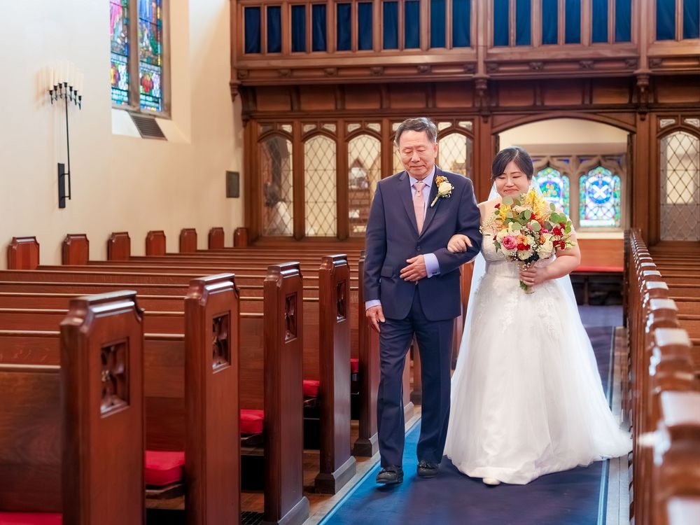 Father walking the bride down the aile during a Toronto wedding session