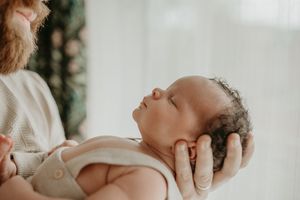 Close-up photographs showing gentle embraces and tender moments in a bright, natural light setting.