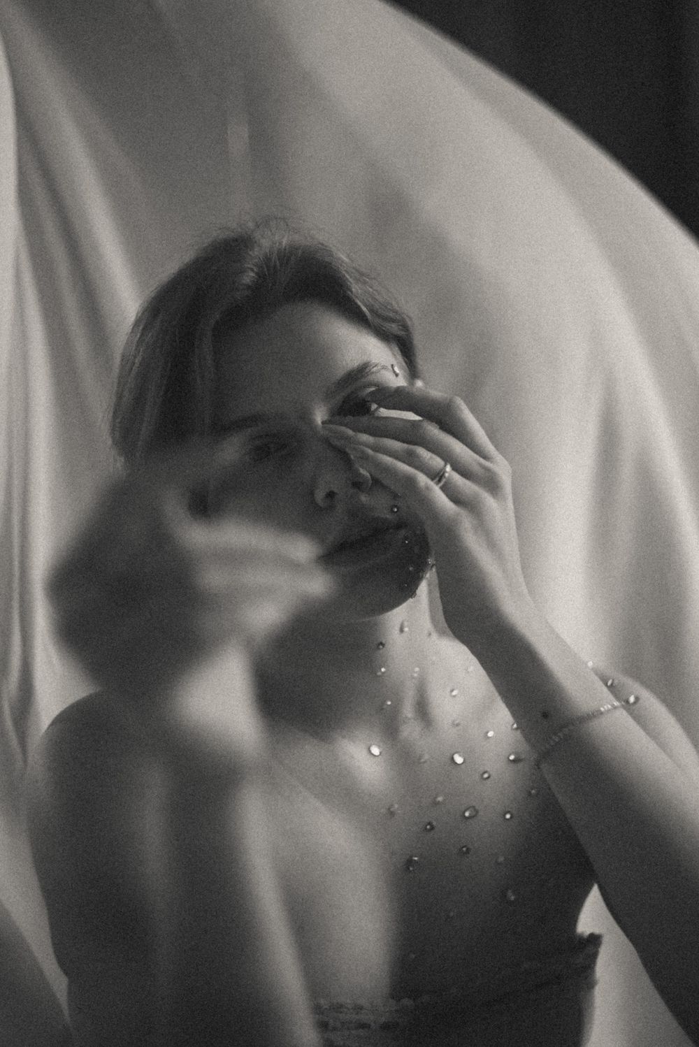 Artistic black and white sequence capturing emotional moments with dramatic lighting.