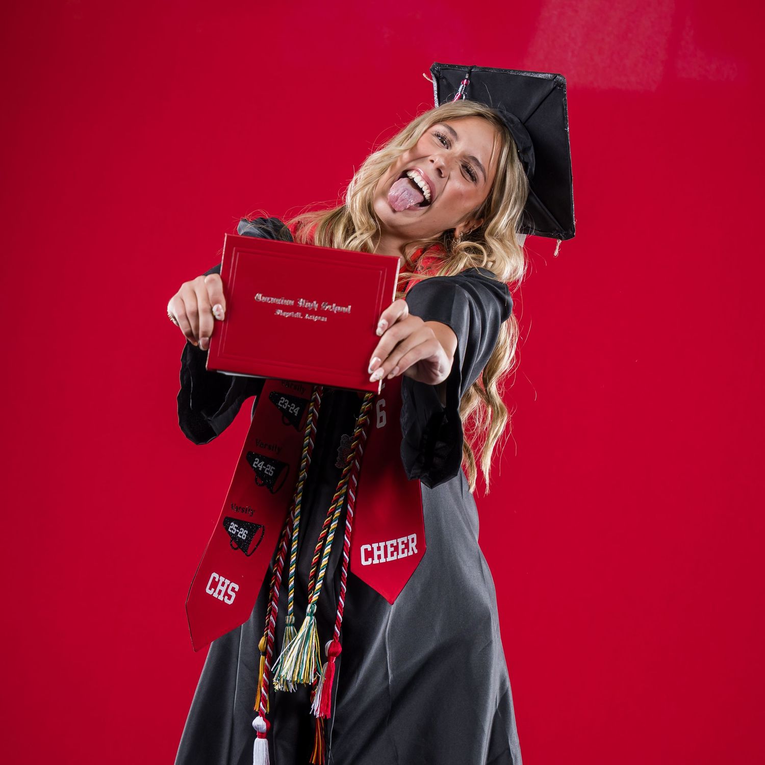 CHS graduate poses for 2025 Coconino High School commencement photos by Sean Openshaw Photography.