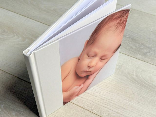 Linen photo book of new born baby boy, Auckland photography studio,