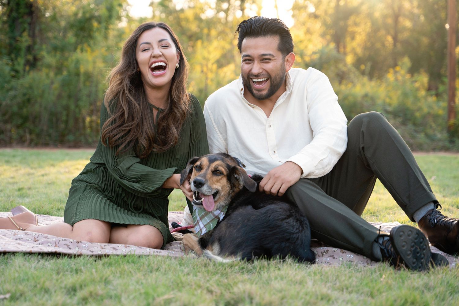 Candid dog portrait session with laughing owners in Houston park.