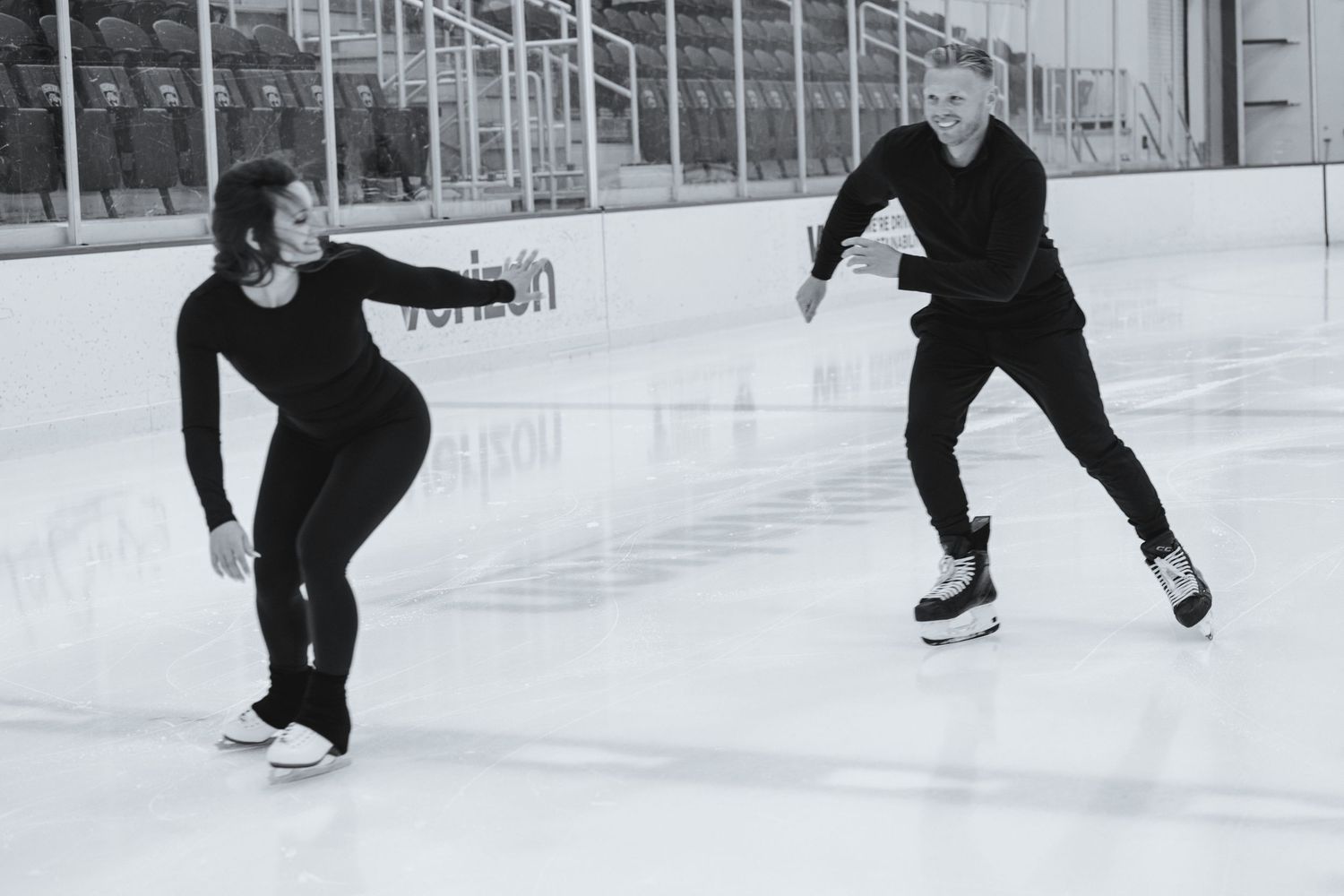 Candid wedding photographer capturing couple on ice rink for unique South Florida engagement session