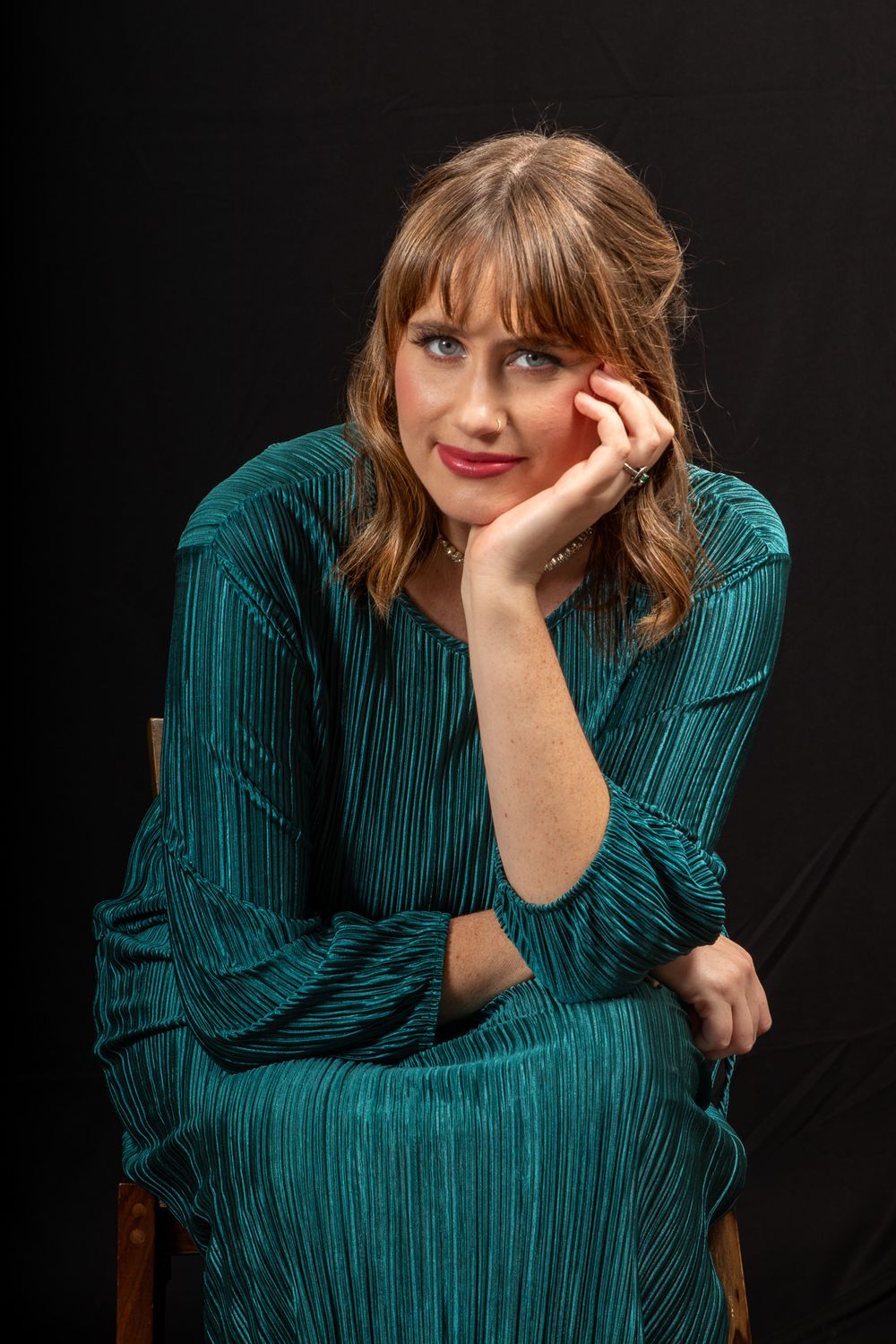 Editorial portrait of a woman resting her chin on her hand, photographed by Kai Shoots in Greater Noida, Delhi-NCR.