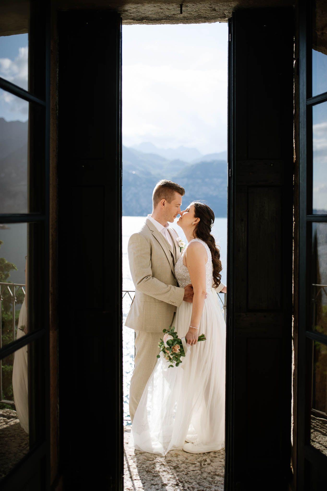 Elegant newlywed portrait at Castello Scaligero in Malcesine overlooking Lake Garda, Italy