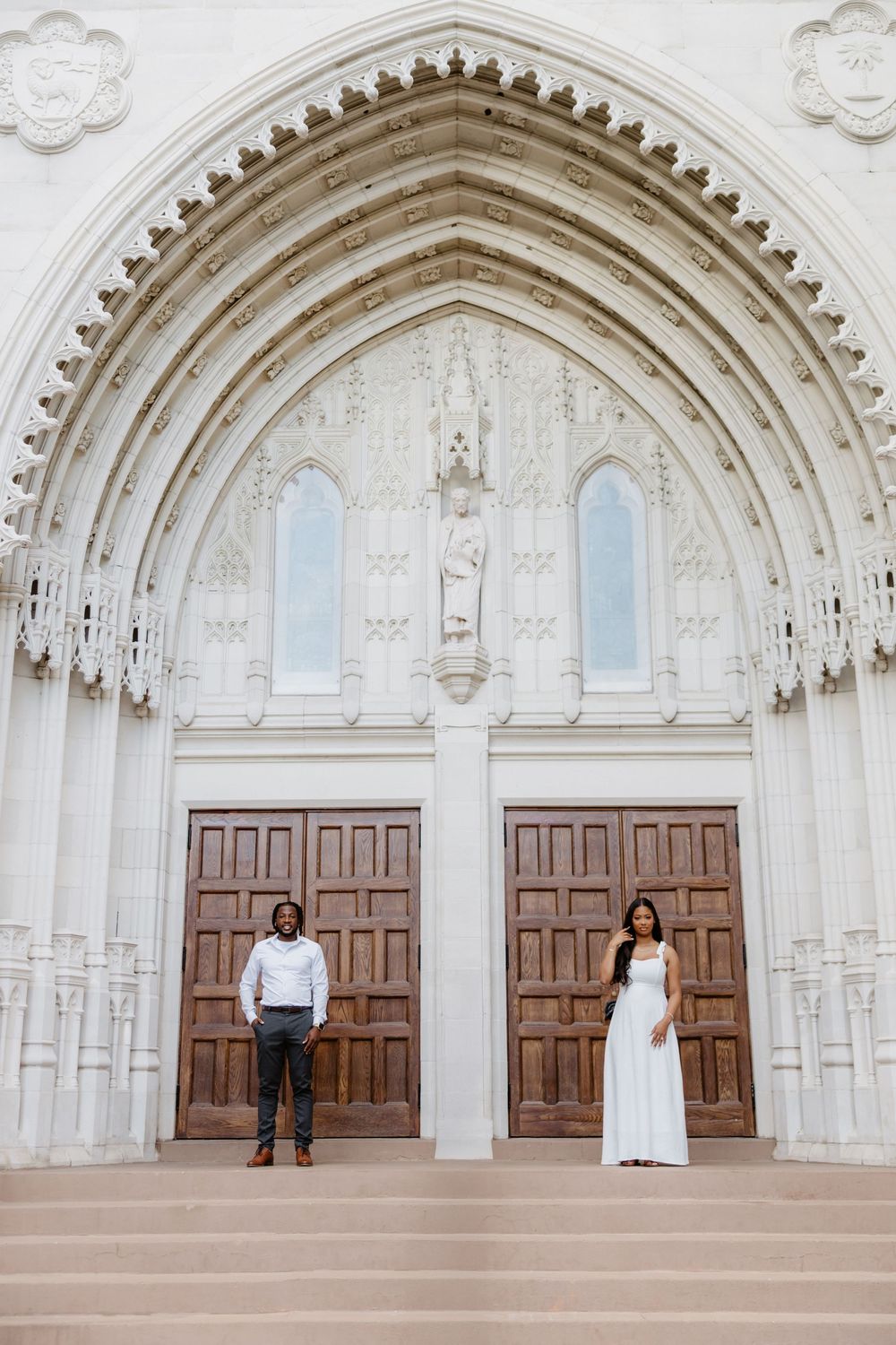 Timeless Downtown Orlando engagement session with elegant white outfits and architectural backdrop.