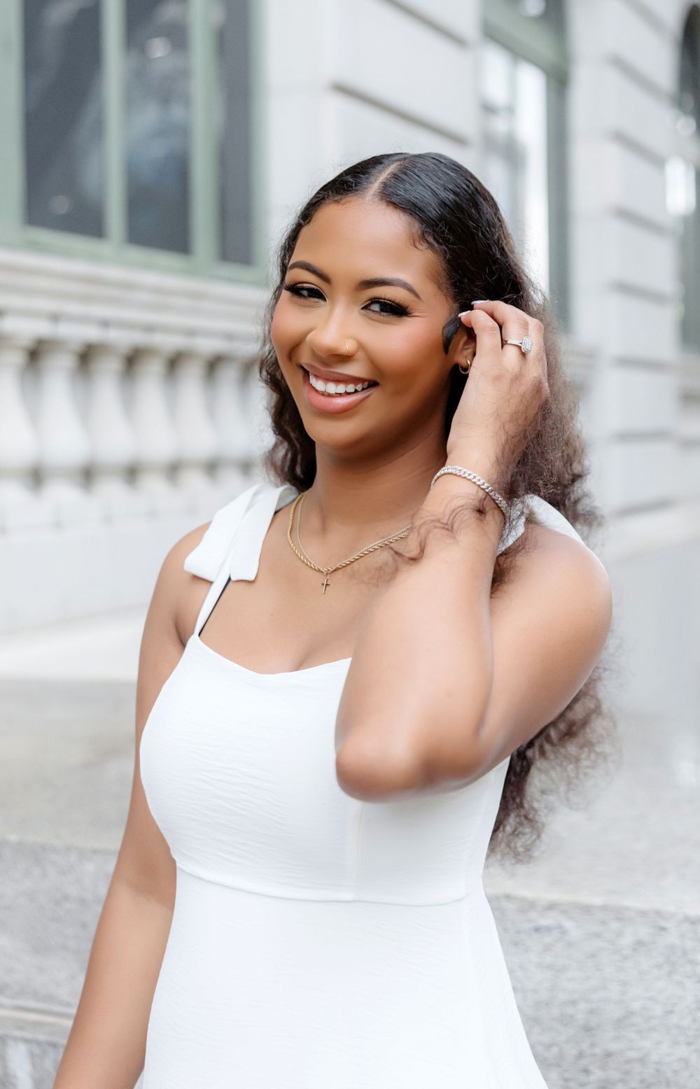 Bride-to-be showing her engagement ring during a Downtown Orlando engagement session.