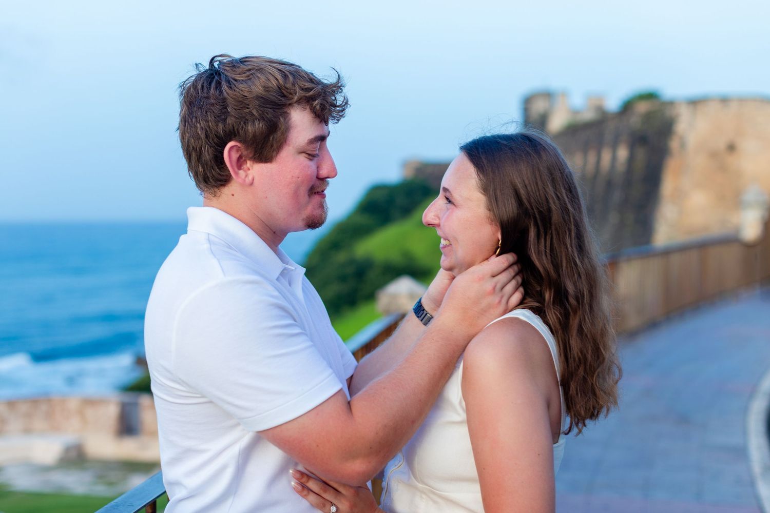 Couples portrait in front of Castillo San Cristóbal. Engagement photo session in Old San Juan, Puerto Rico.