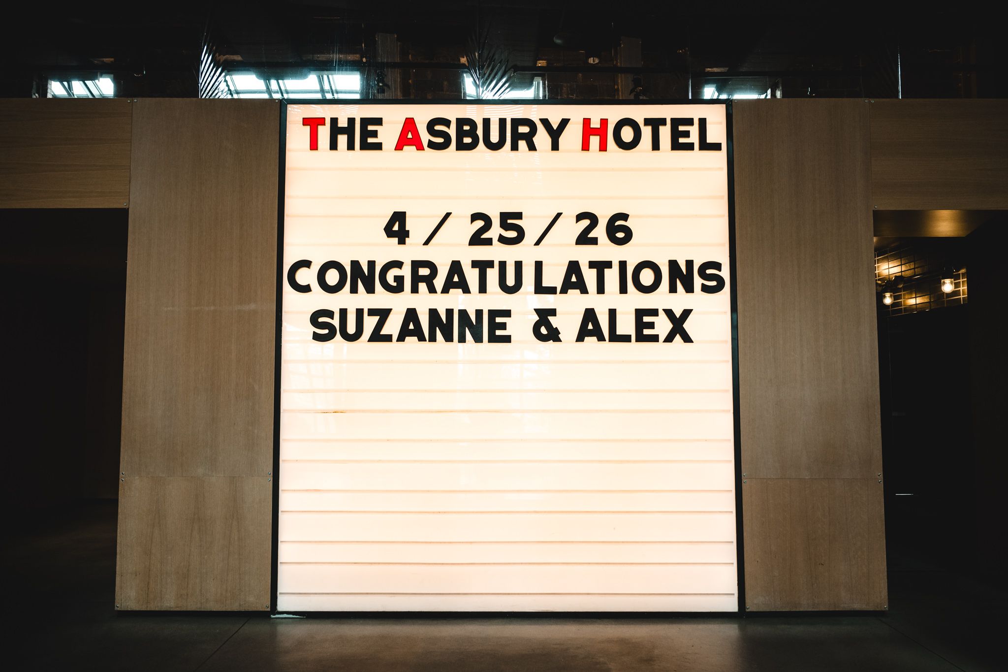 The Asbury Hotel marquee sign congratulating Suzanne and Alex on their wedding on April 25, 2026.