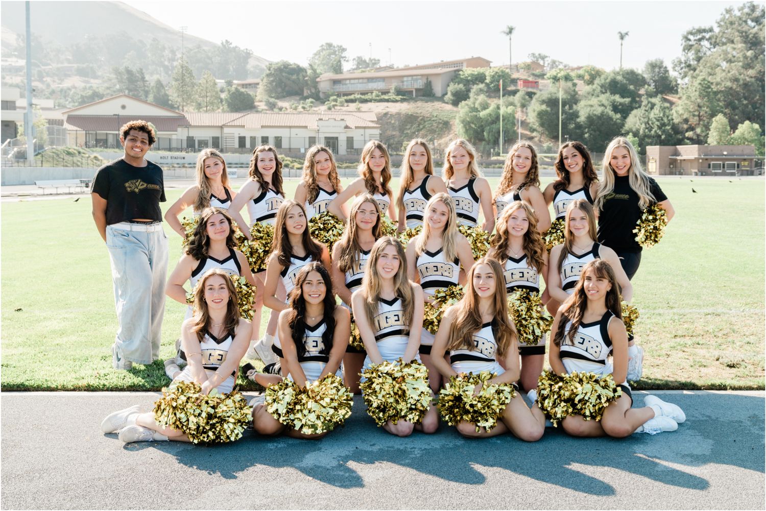 Fun and vibrant SLO High dance team group photo at Holt Stadium showcasing school spirit and team energy during fall season.