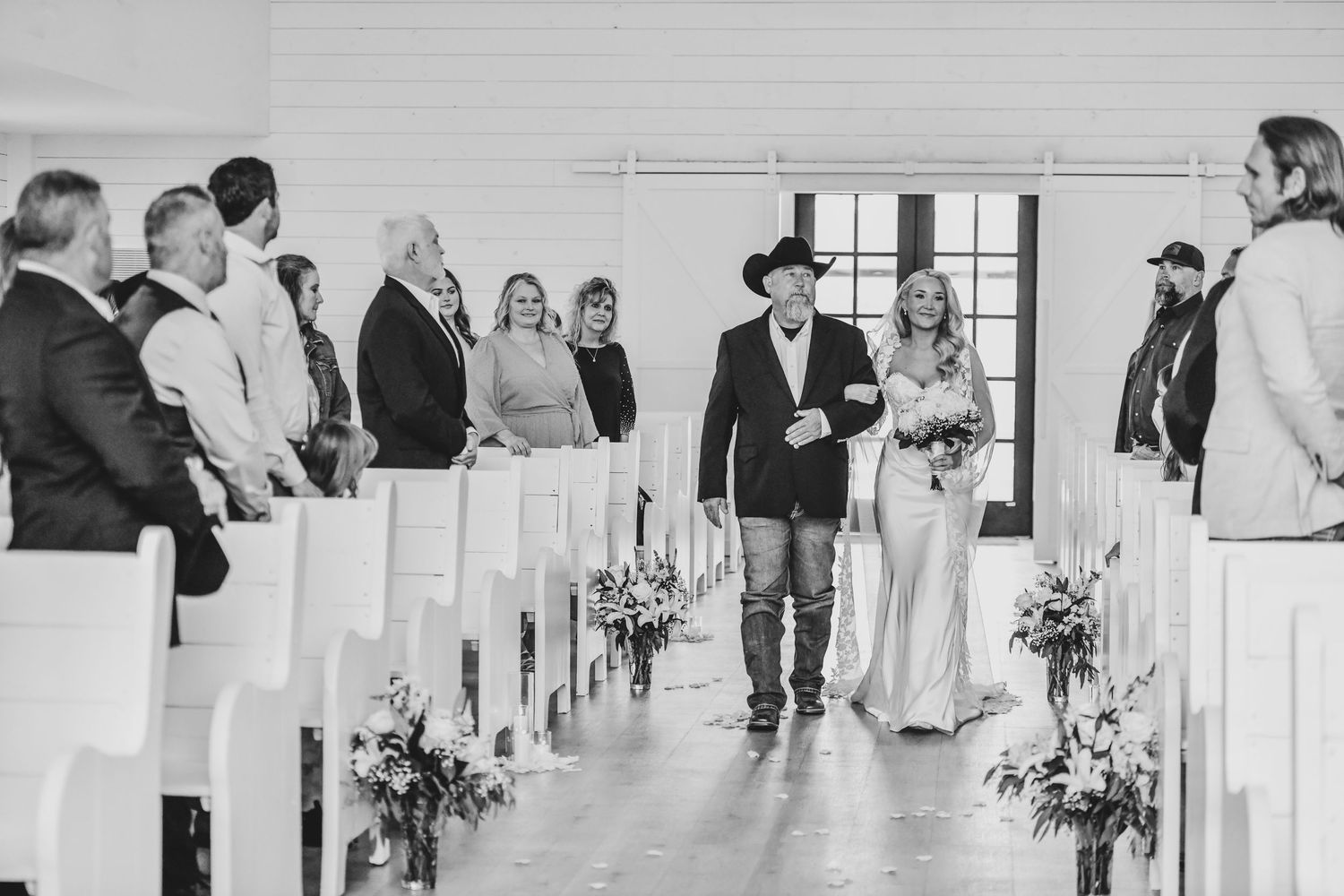 Bride walking down aisle with father at The Gardenia chapel