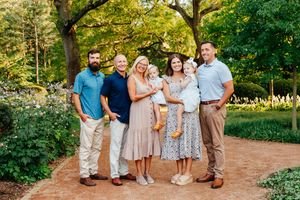 A family embracing and looking at the camera