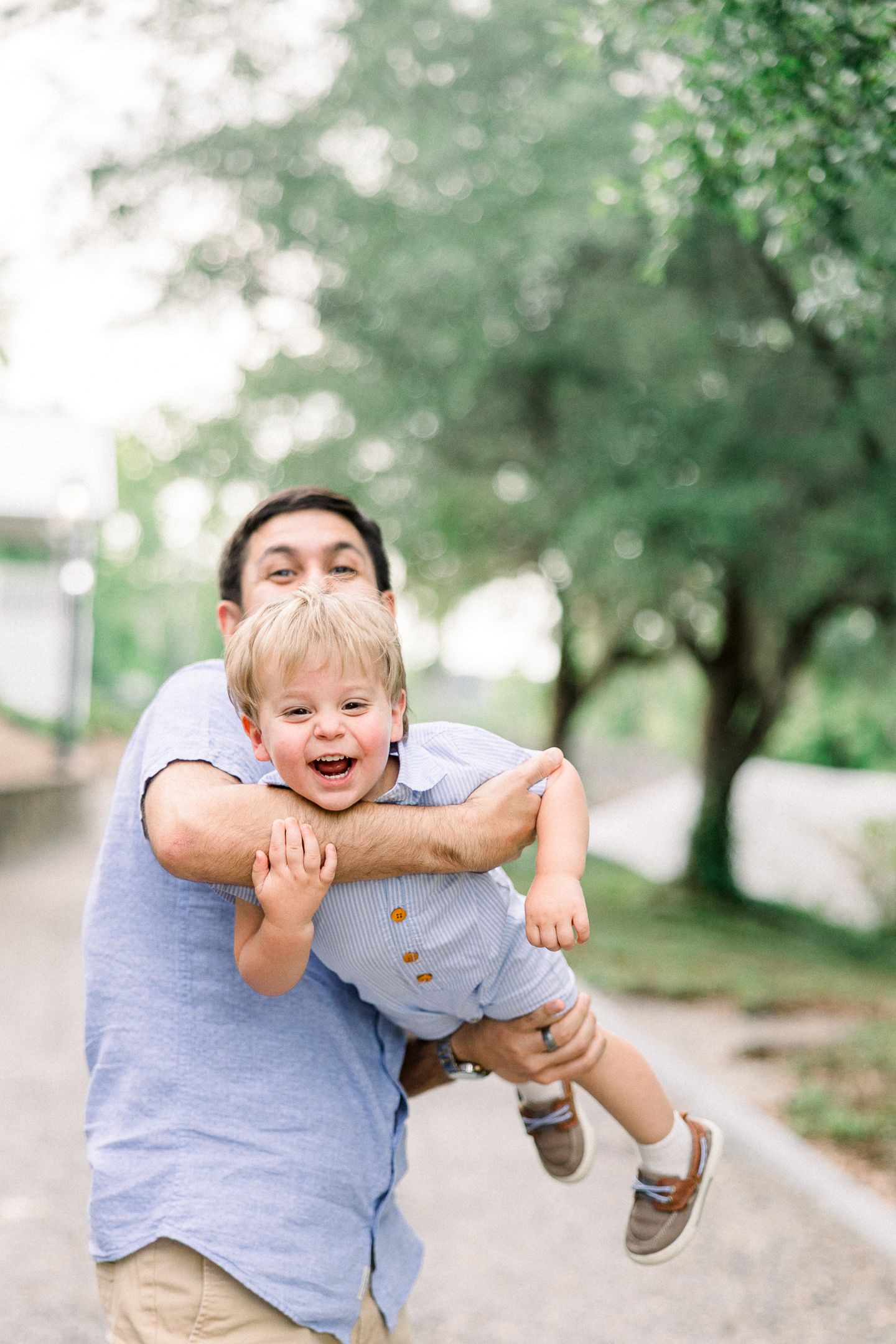 Candid family portraits with four boys at Savannah Rapids Pavilion in Augusta GA
