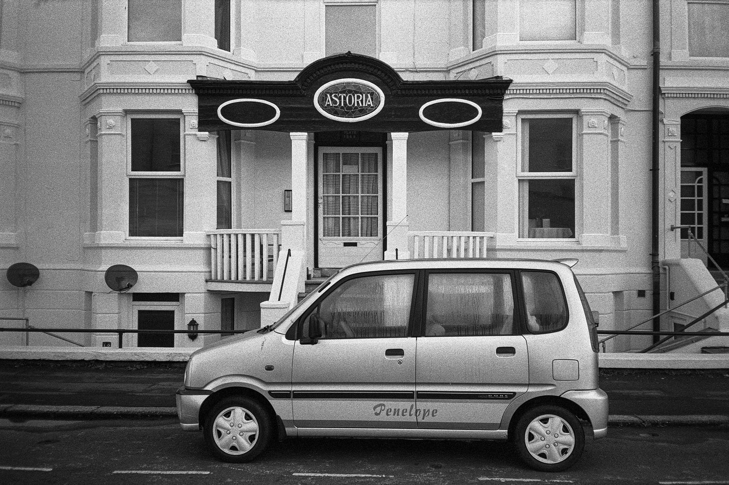 Fine art amusing photograph of seaside car and guest house hotel by Richard Simpson author and photographer J J Salkeld
