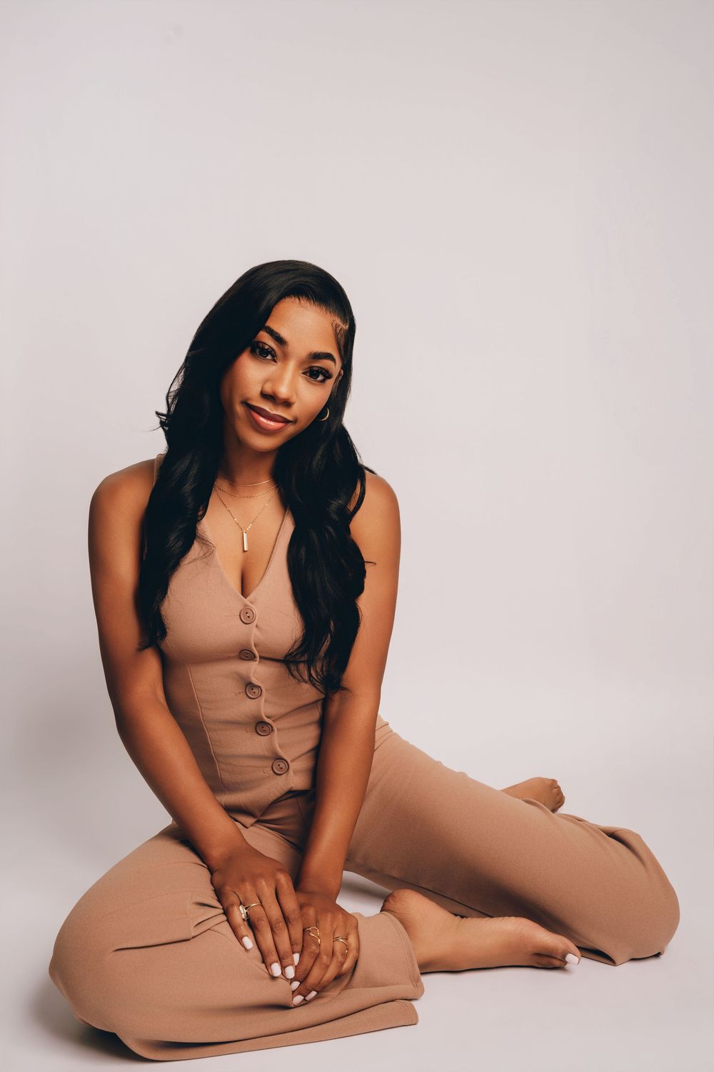 Studio headshot of a woman in neutral-toned outfit with soft lighting, taken by Devonta Battle Photography in Valdosta, GA