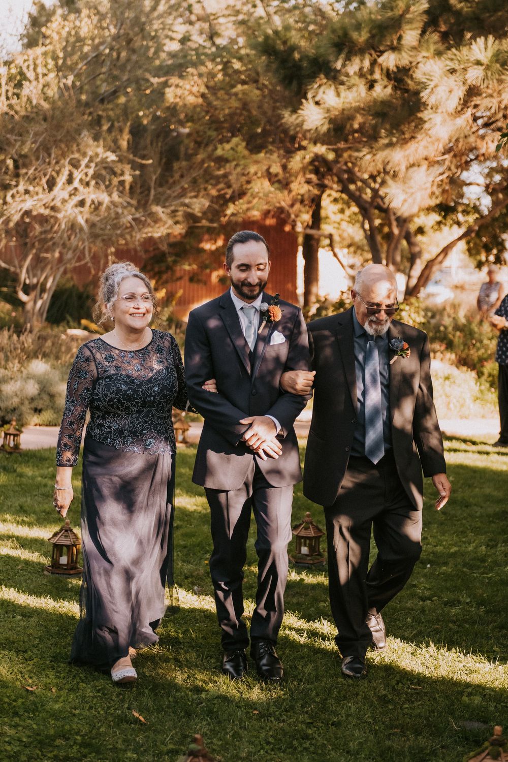 Wedding party members walk together down the aisle. Small weddings in New Mexico. Intimate wedding venues. Albuquerque Garden Center wedding