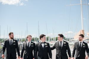 A groom and his groomsmen on a Hamilton pier in mid august.