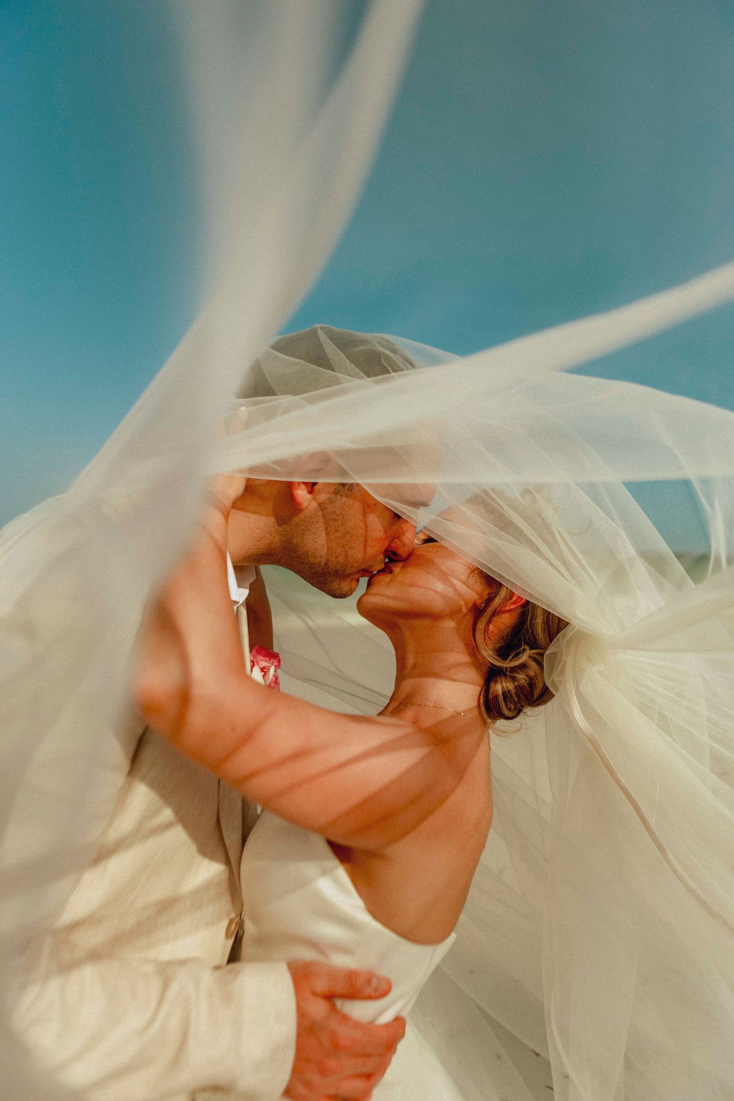 Bride and groom holding hands during a beach wedding in Zanzibar