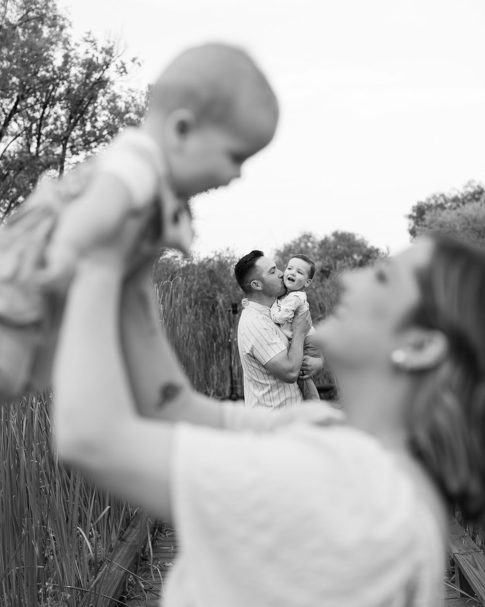 A sequence of black and white photos showing joyful moments captured in an artistic style.