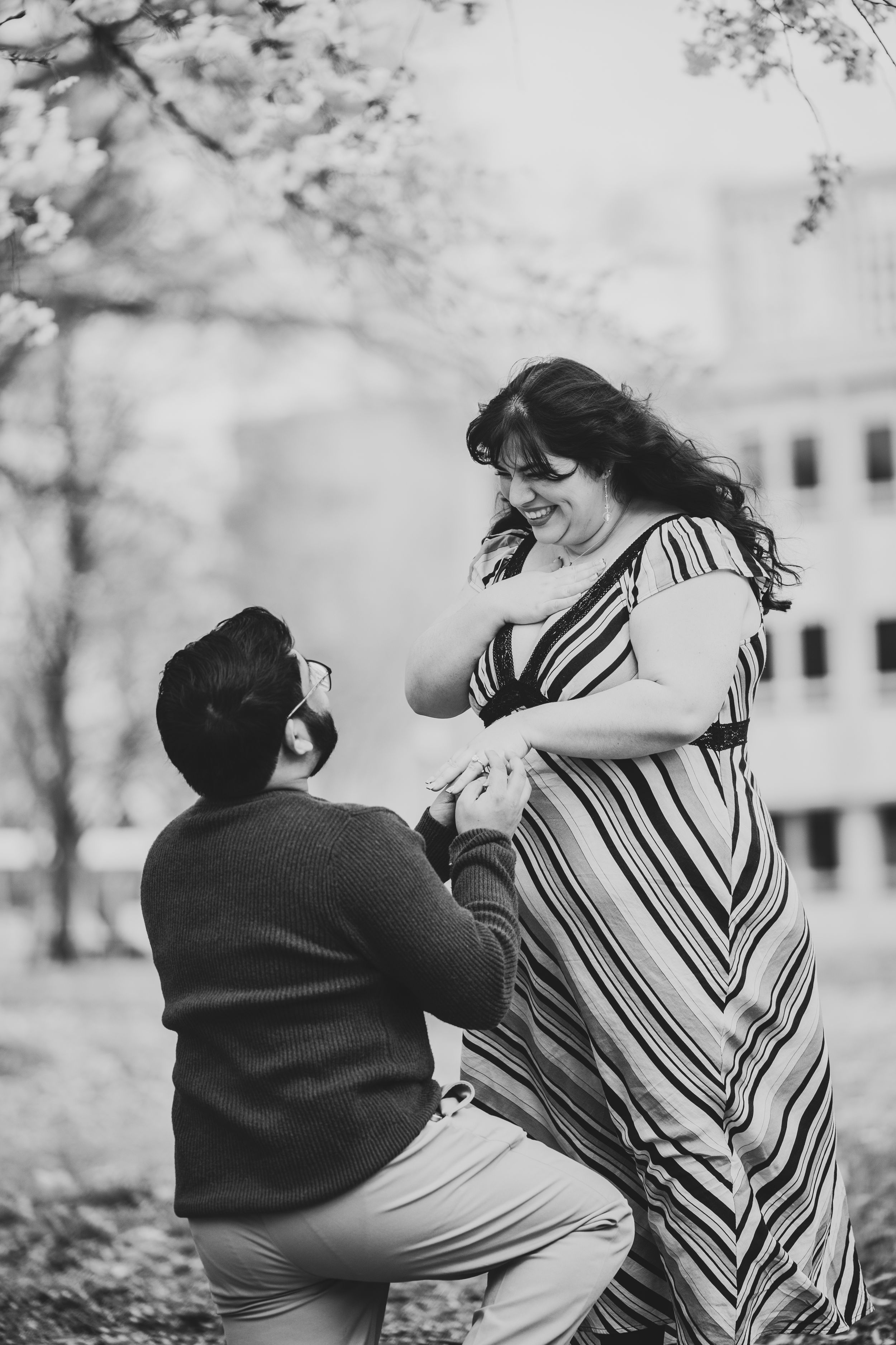 Black and white photo series showing a couple during an intimate surprise proposal moment