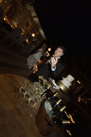 Wedding reception table with elegant crystal candelabras and decorative settings.