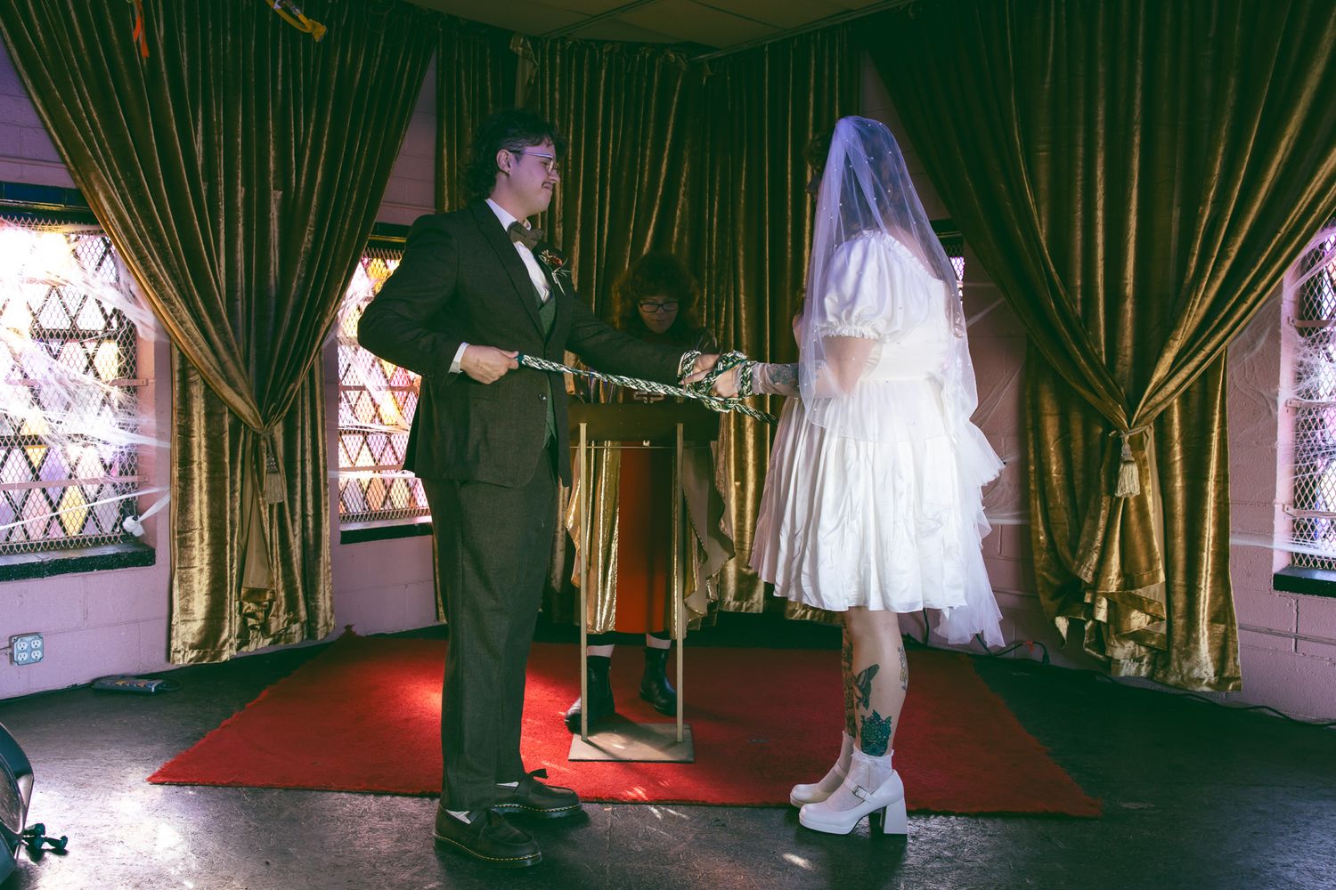 couple doing handfasting ceremony during wedding in Asheville NC