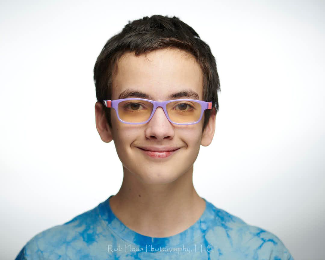 Nice big smile from Marshall.  In the studio with a gray/white background.