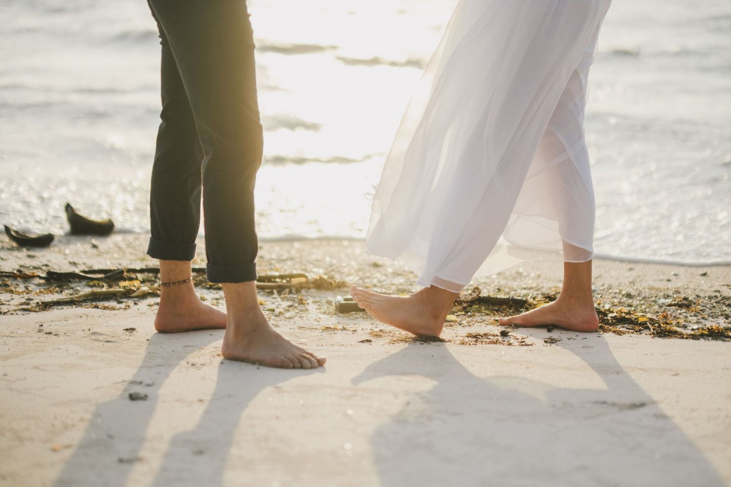 Newlyweds feet on a Colombian beach.