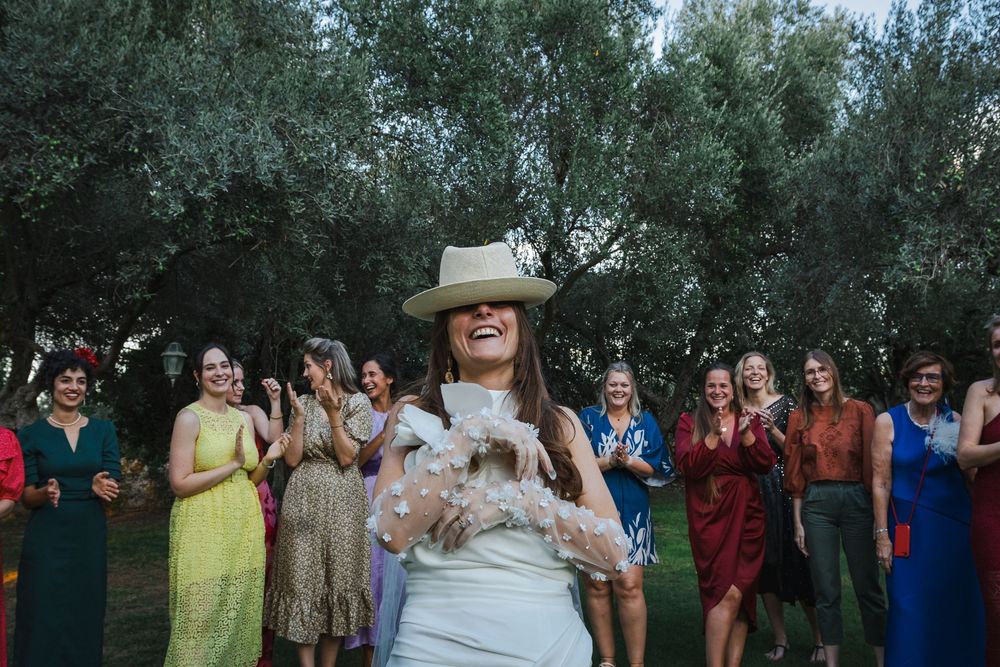 A sequence of wedding party photos taken outdoors among green trees showing guests celebrating together.