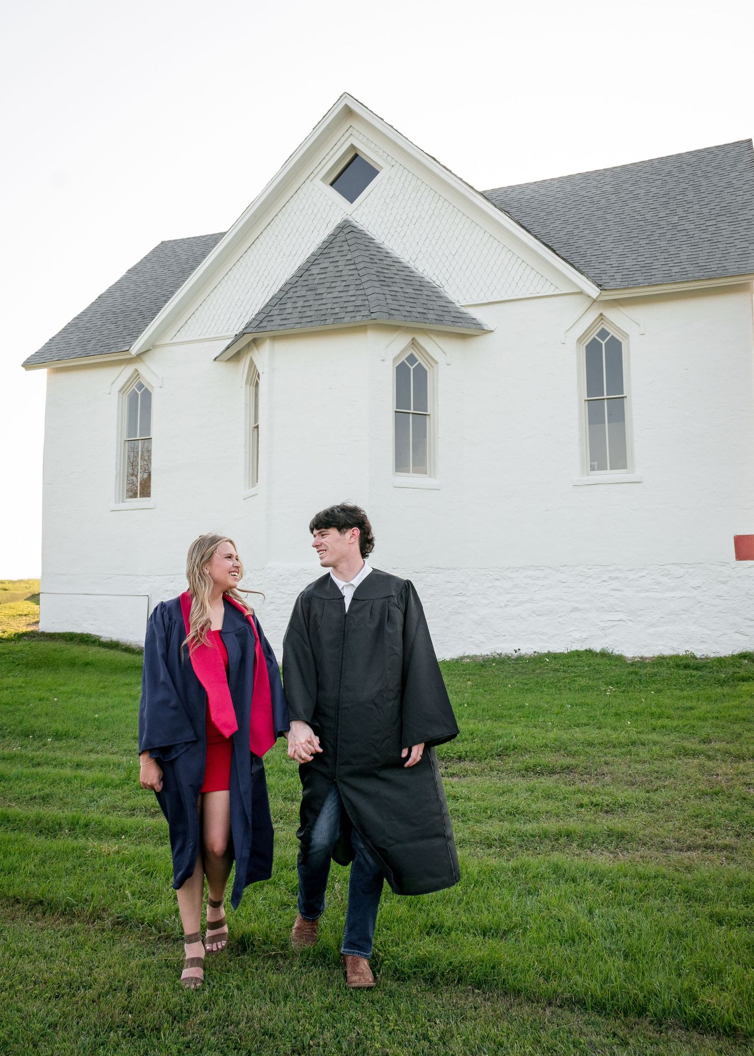 Couple walking together along Nolan Creek in Belton Texas during graduation session