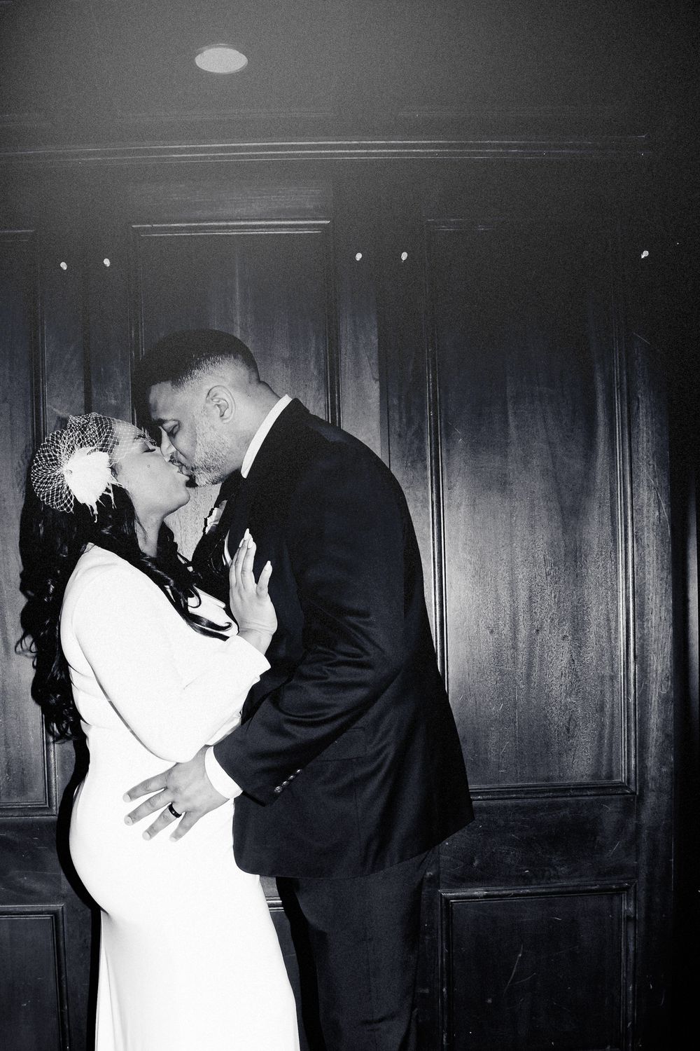 A black and white photo series shows a couple in formal attire sharing intimate moments during what appears to be their wedding.